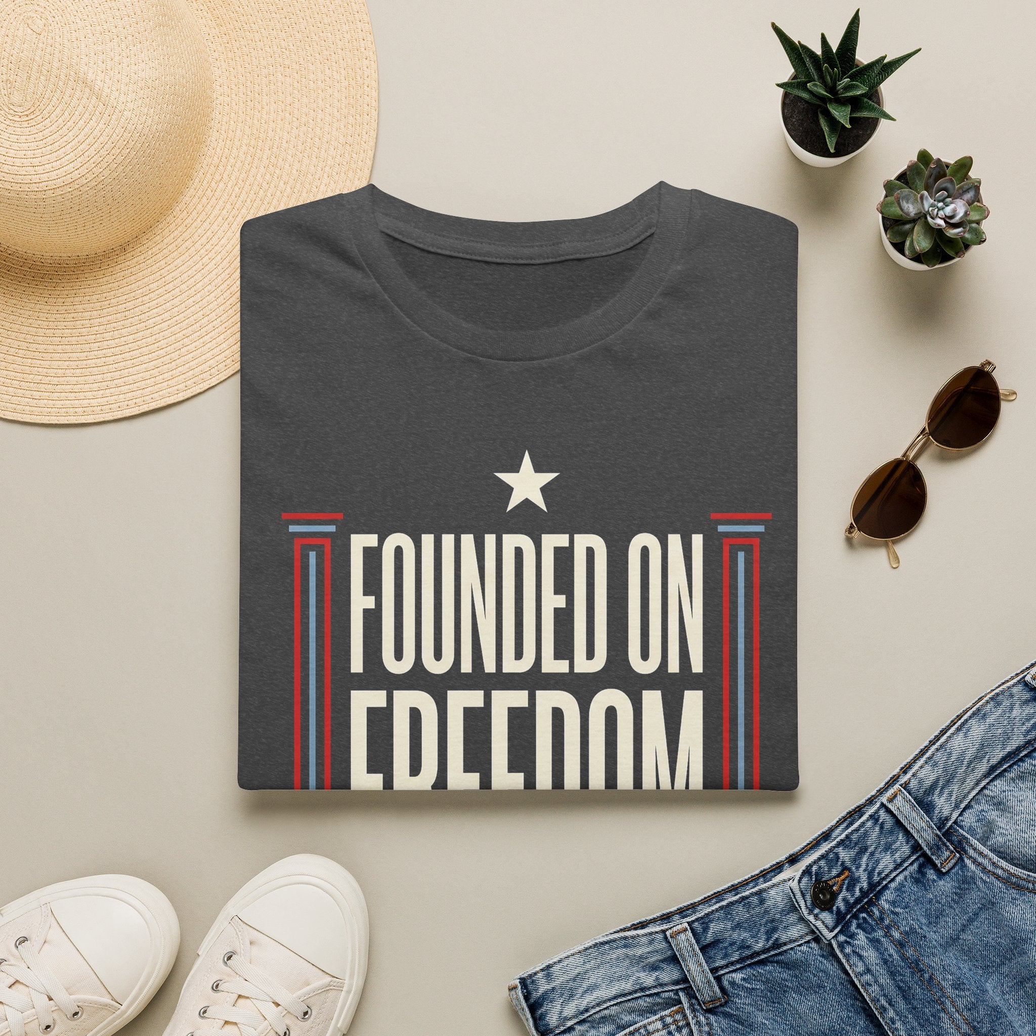 Dark gray short-sleeve t-shirt with white star and "Founded on Freedom" graphic