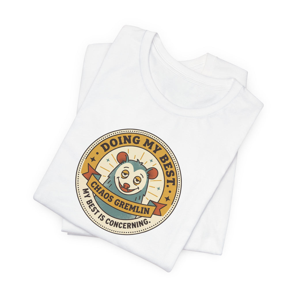White T-shirt with round cartoon gremlin badge graphic on the chest