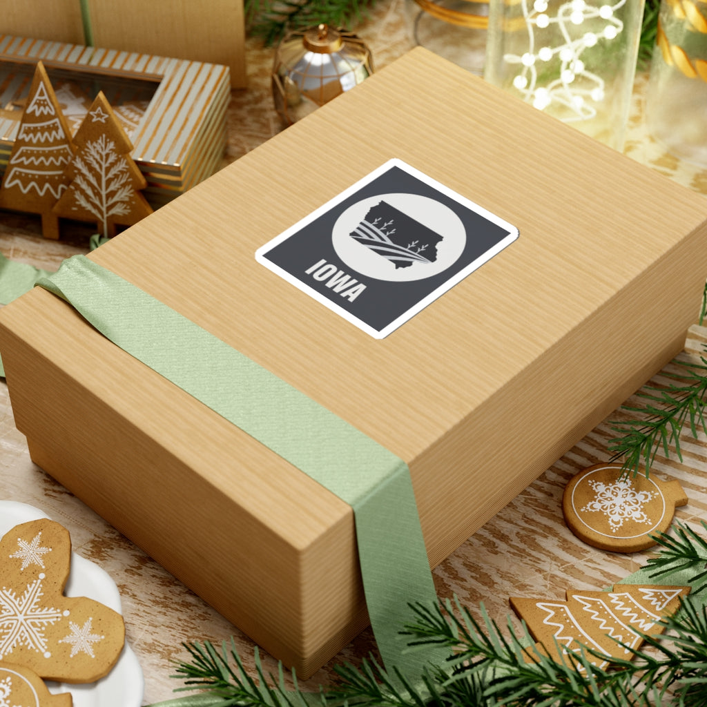 Iowa farmland graphic sticker on a gift box lid: black square, white circle emblem, “IOWA”