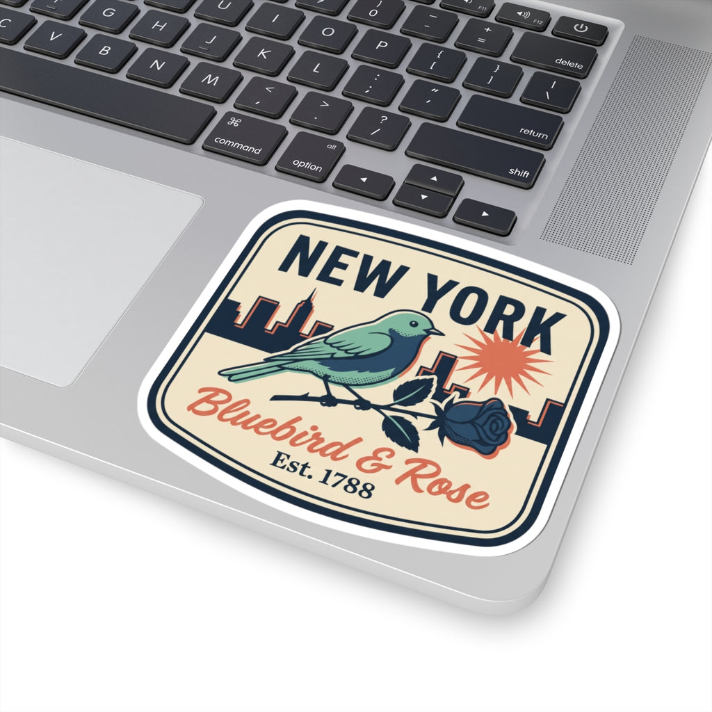 Close-up NEW YORK bluebird and rose decal on laptop keyboard