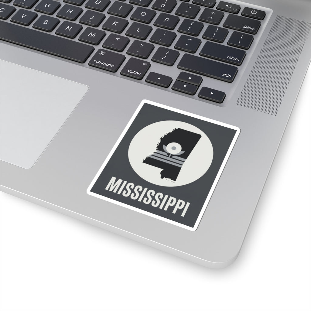 Mississippi silhouette kiss-cut sticker on laptop, circular emblem and “MISSISSIPPI”