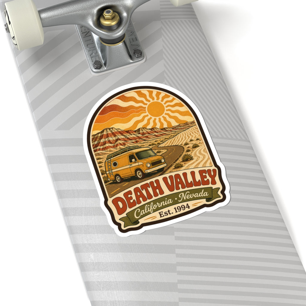 Kiss-cut sticker on skateboard deck with yellow camper van, Death Valley California Nevada Est. 1994