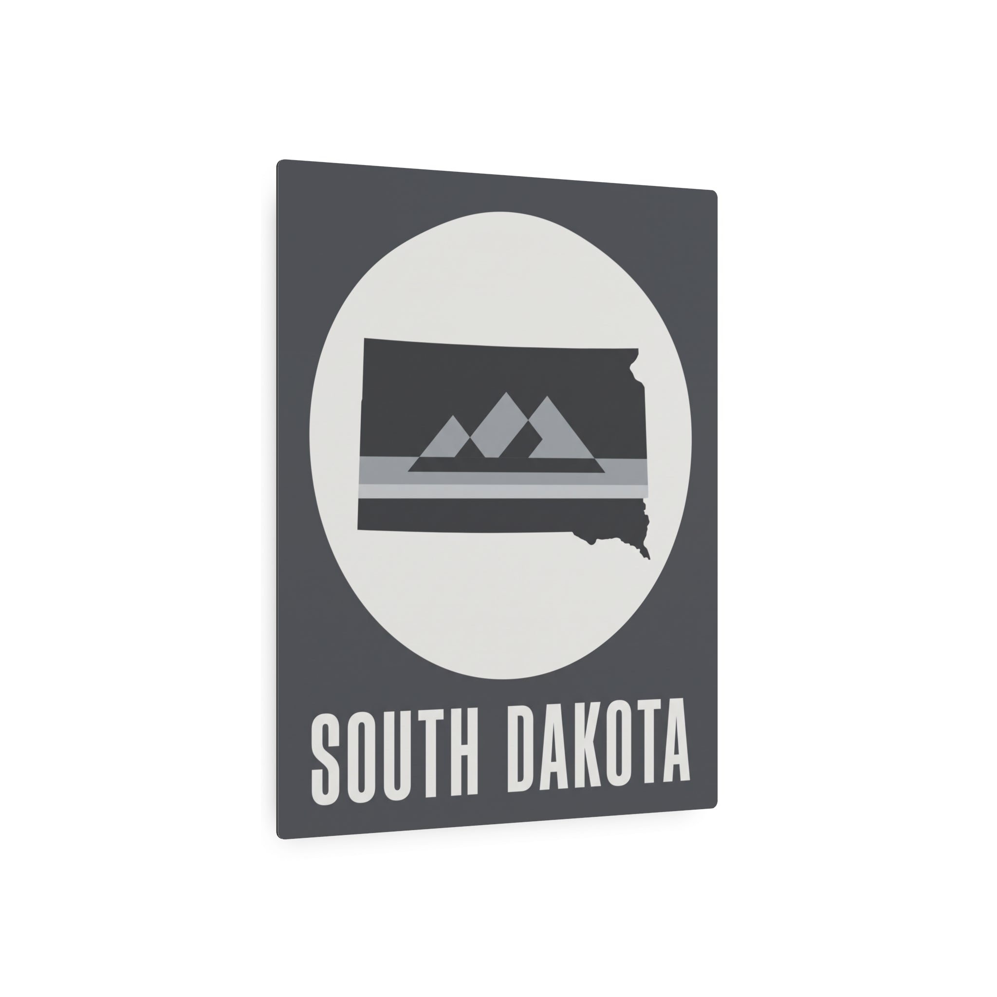 South Dakota metal wall sign, gray with oval mountain silhouette and 'SOUTH DAKOTA' title