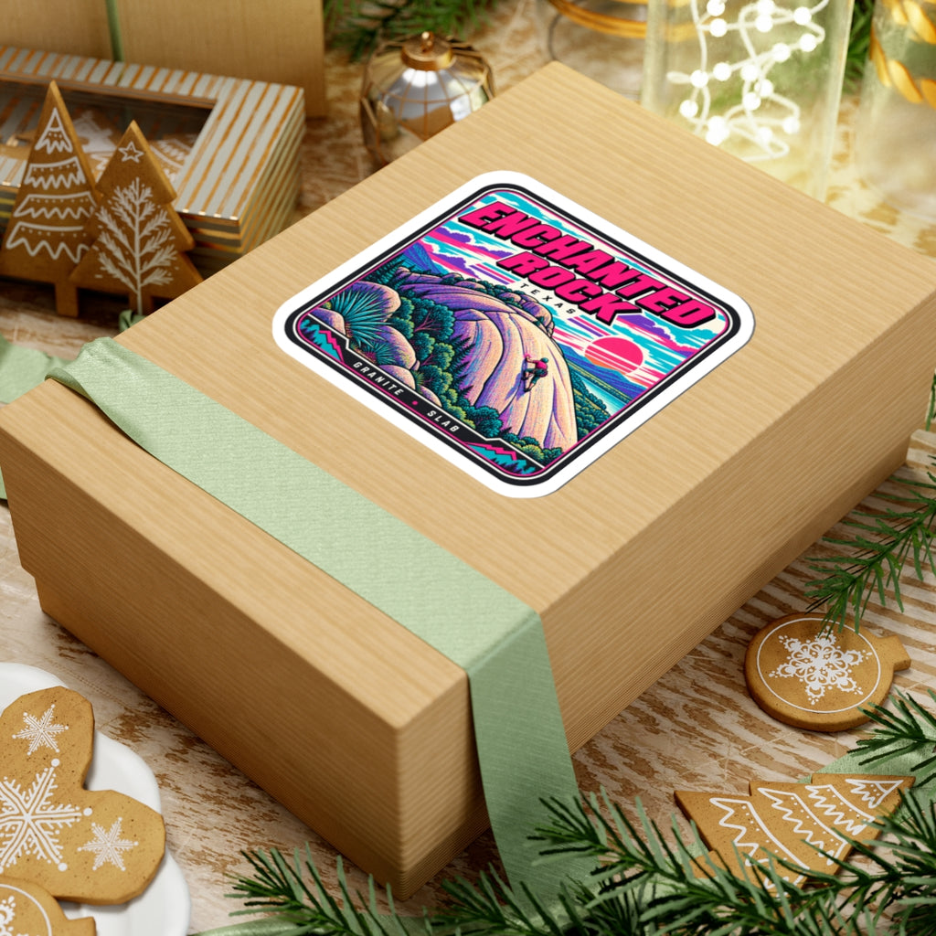 Square kiss-cut sticker on a gift box lid, purple rock scene and pink sunset