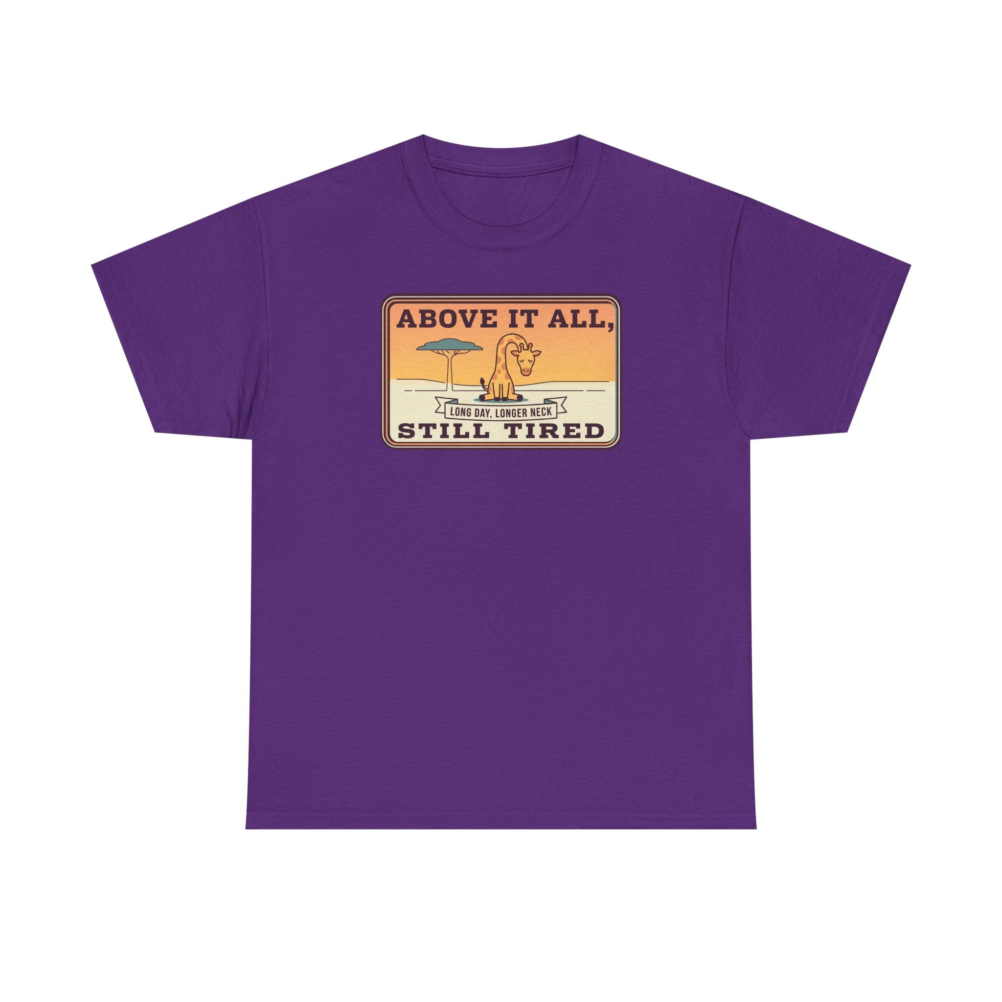 Purple short-sleeve crewneck tee with chest “Above It All, Still Tired” graphic badge.