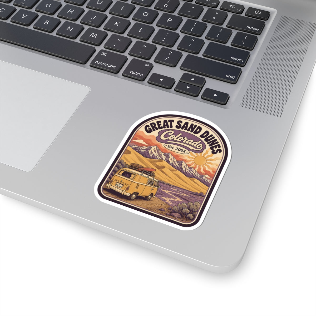 Great Sand Dunes Colorado sticker on a laptop palm rest; vintage camper desert dunes design
