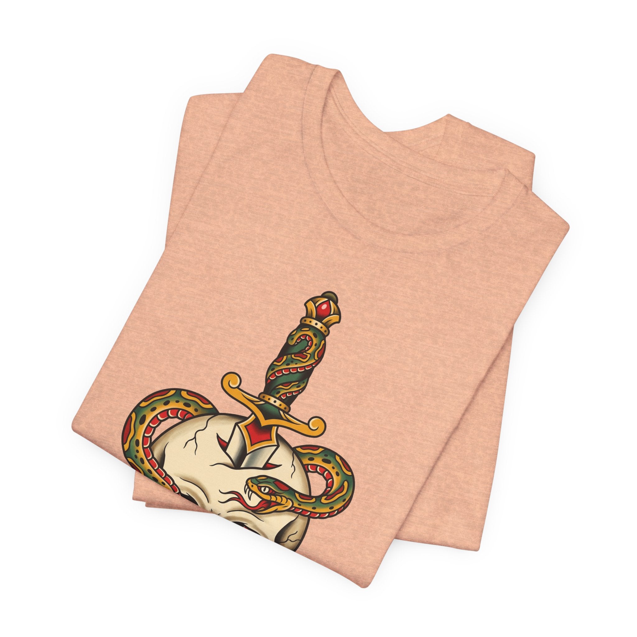 Peach T-shirt folded, showing snake skull dagger graphic on the back