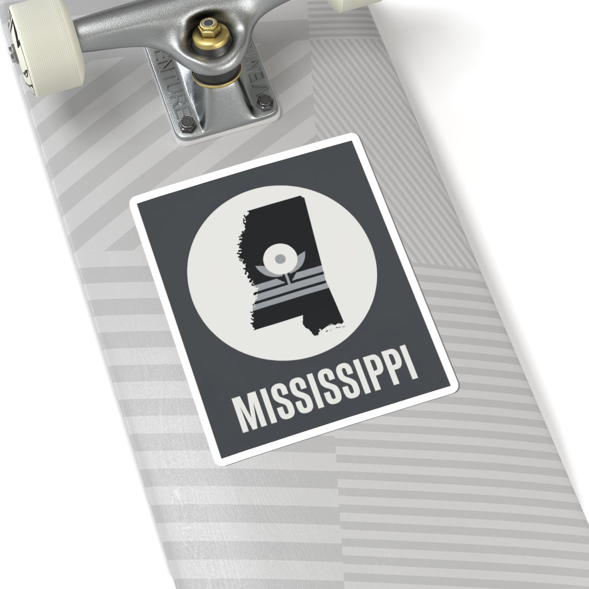 Mississippi silhouette sticker on light patterned surface, circular emblem and “MISSISSIPPI”