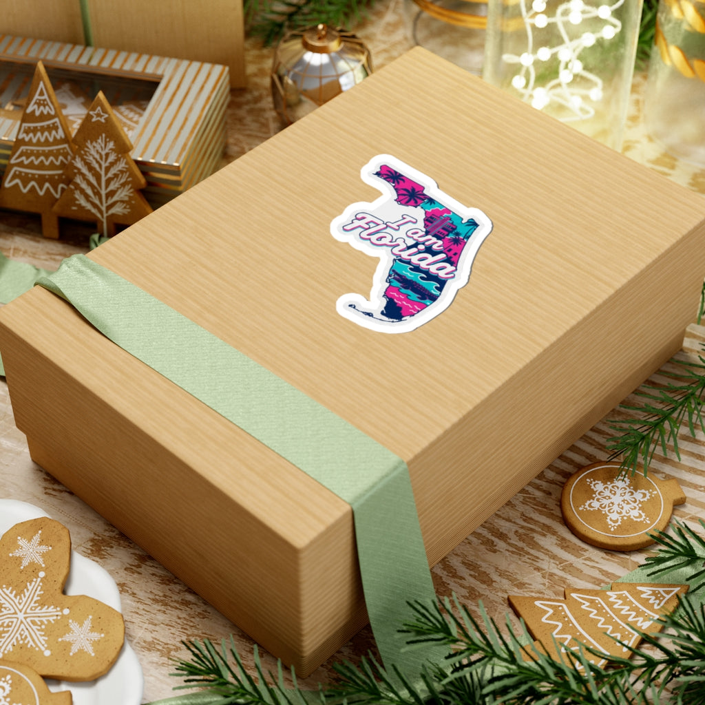 I am Florida sticker on a wrapped gift box, colorful Florida outline with waves