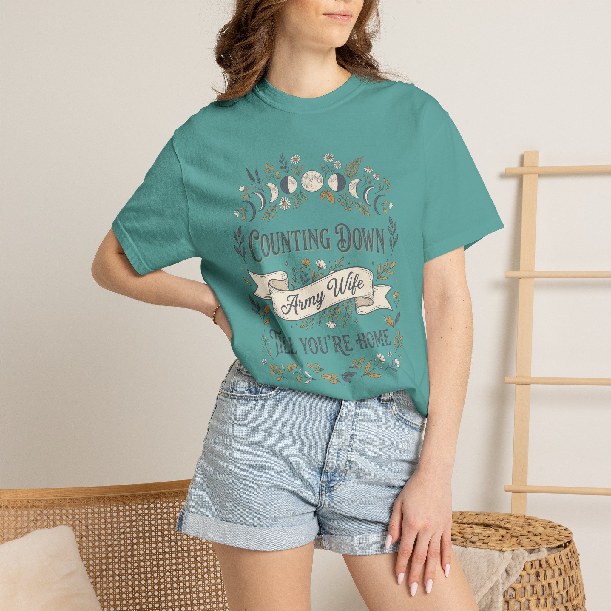 Teal crewneck t-shirt with floral countdown graphic on the front
