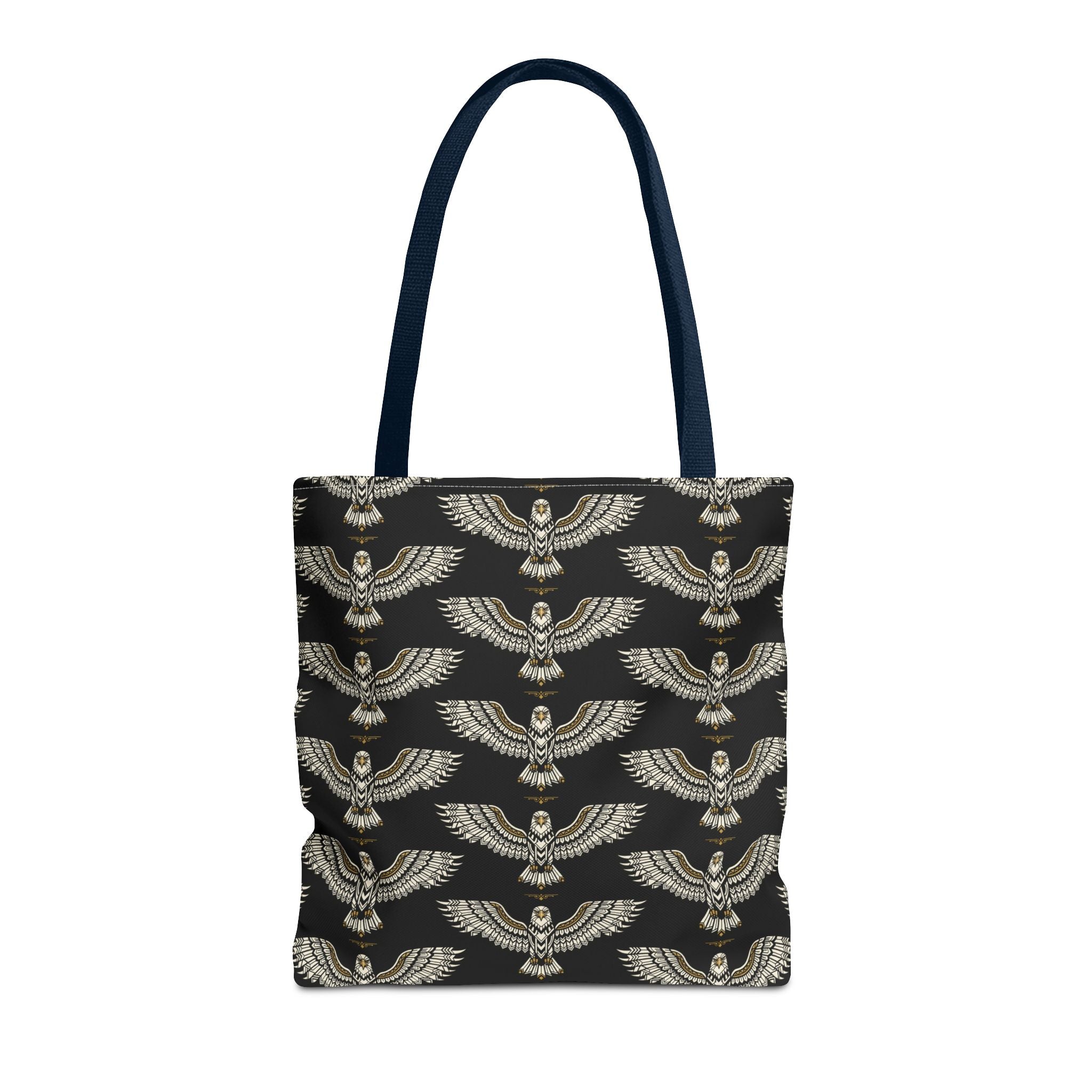 Tote bag featuring winged scarab pattern on black fabric, gold emblems, navy handles