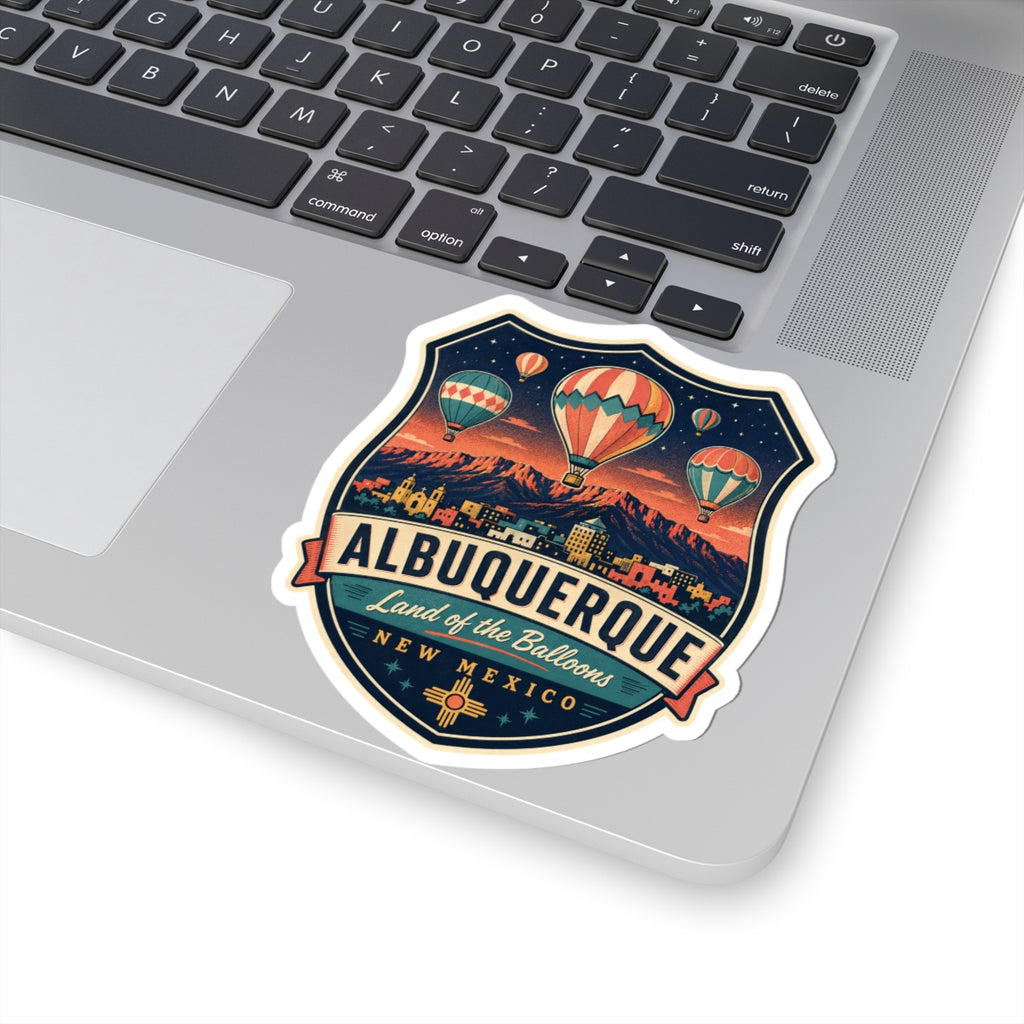 Luggage tag sticker on a laptop: Albuquerque badge with hot air balloons and New Mexico