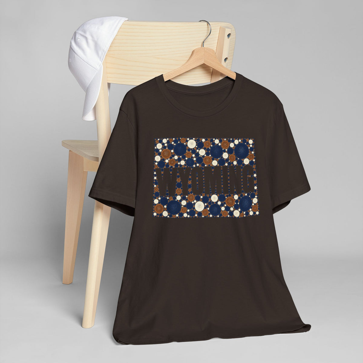 Black crewneck t-shirt with dotted Wyoming map graphic in navy and tan
