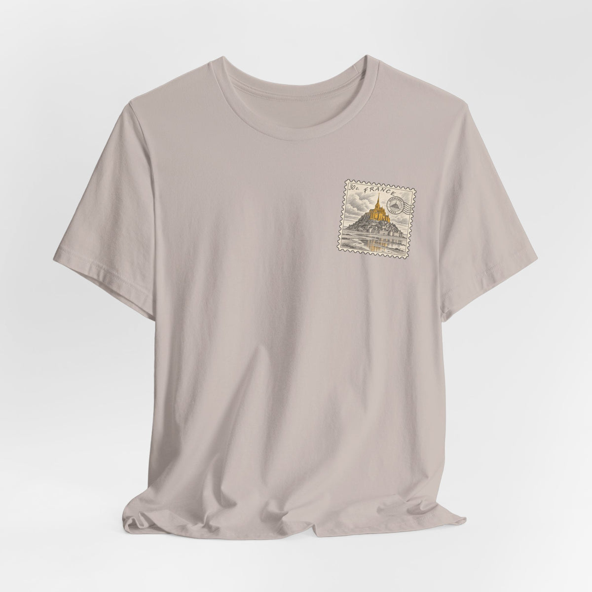 Light pink crew neck T-shirt with small postage-stamp style Mont Saint-Michel emblem