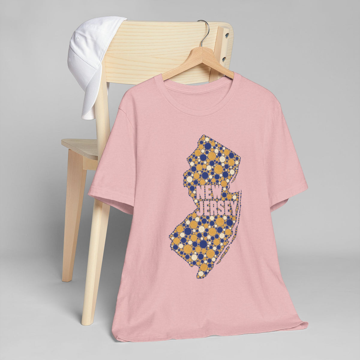 Pink crewneck t-shirt with blue and yellow floral New Jersey map graphic