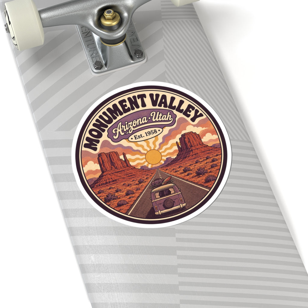 Round Monument Valley sticker on notebook page, showing Arizona-Utah banner and vintage van