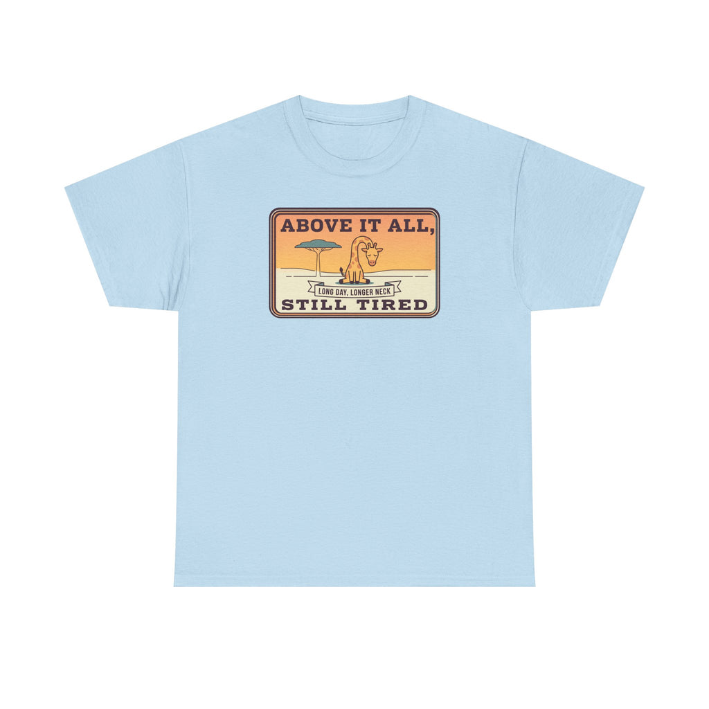 Light blue short-sleeve crewneck tee with chest “Above It All, Still Tired” graphic badge.