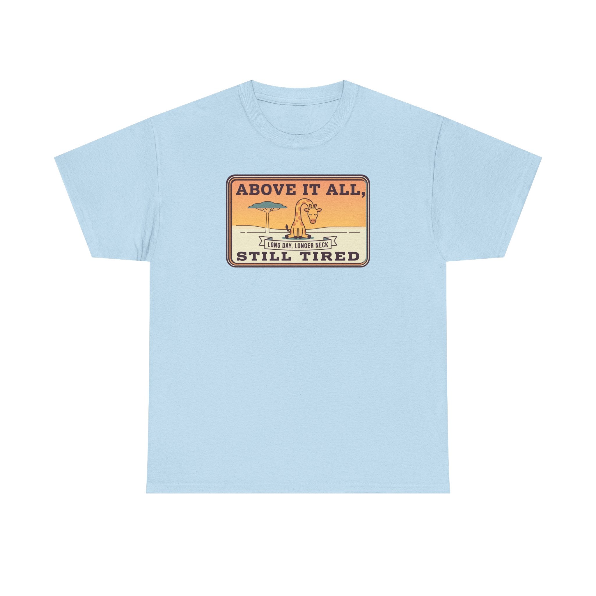 Light blue short-sleeve crewneck tee with chest “Above It All, Still Tired” graphic badge.