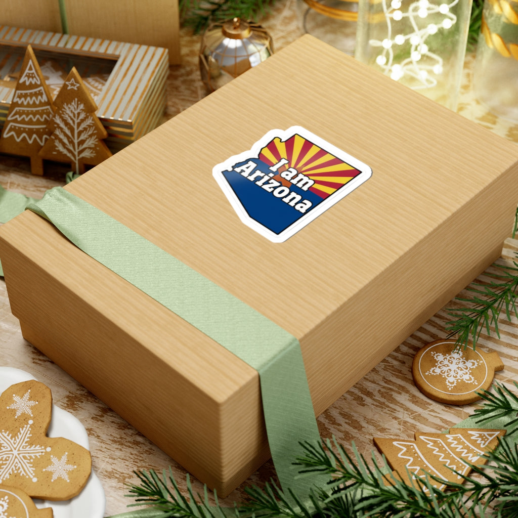 Sticker on wrapped gift box: 'I am Arizona' Arizona-shaped decal with AZ flag