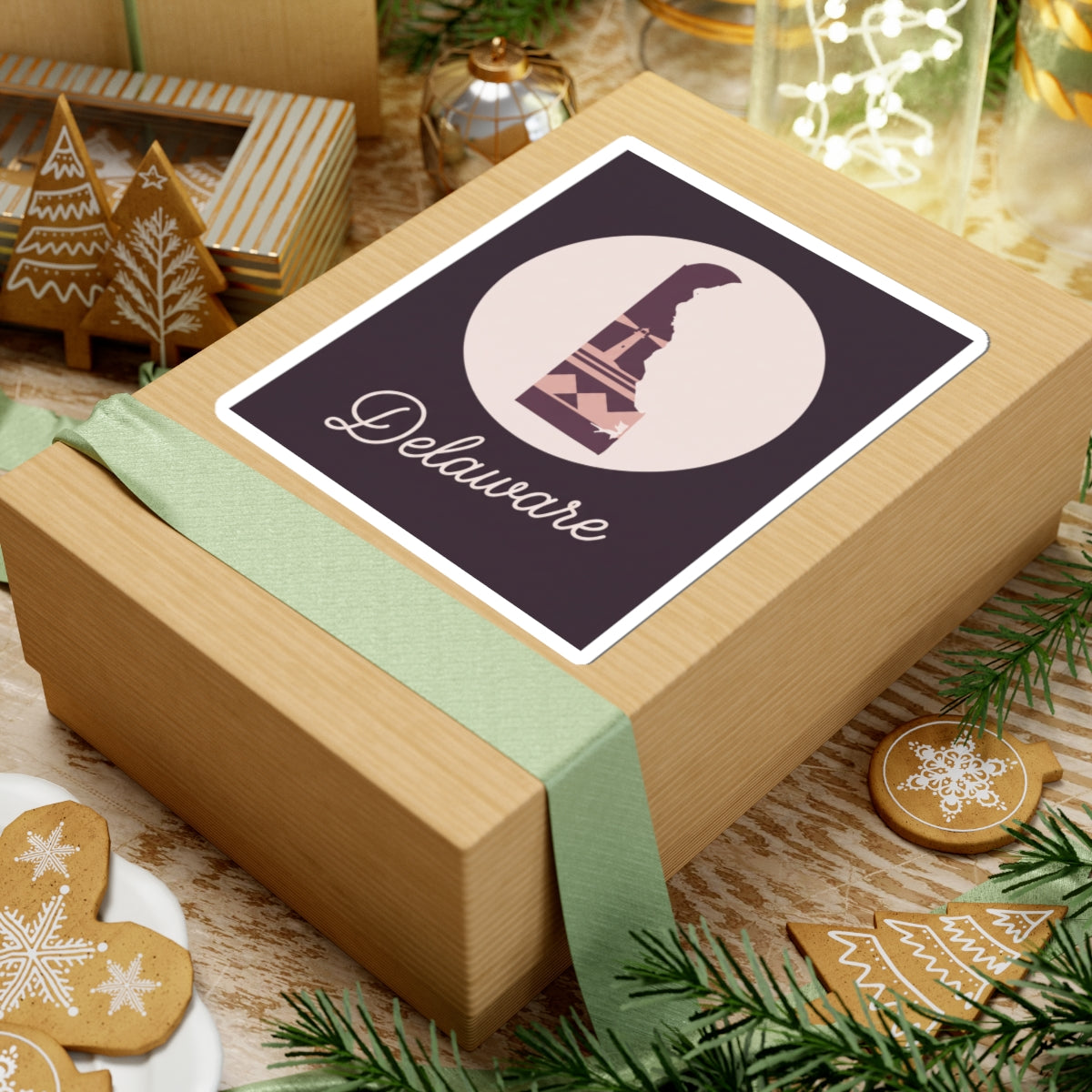 Delaware silhouette vinyl sticker on gift box, mauve lighthouse icon with 'Delaware' script