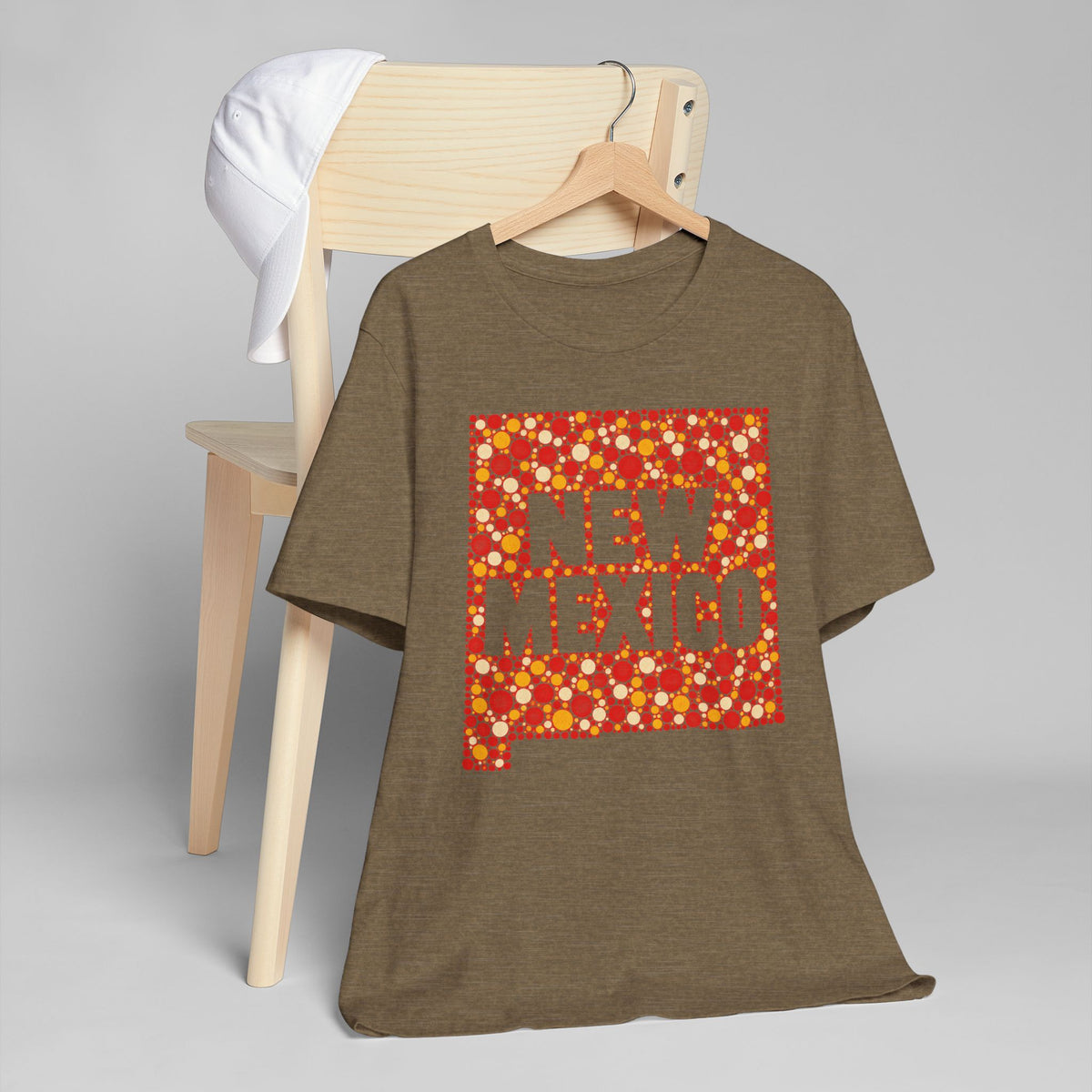 Brown short-sleeve T-shirt with red and yellow “NEW MEXICO” graphic on front