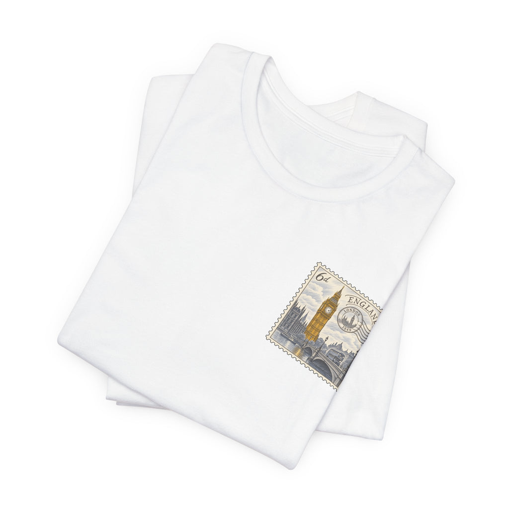 Stack of white short-sleeve T-shirts with small vintage postage stamp graphic on chest