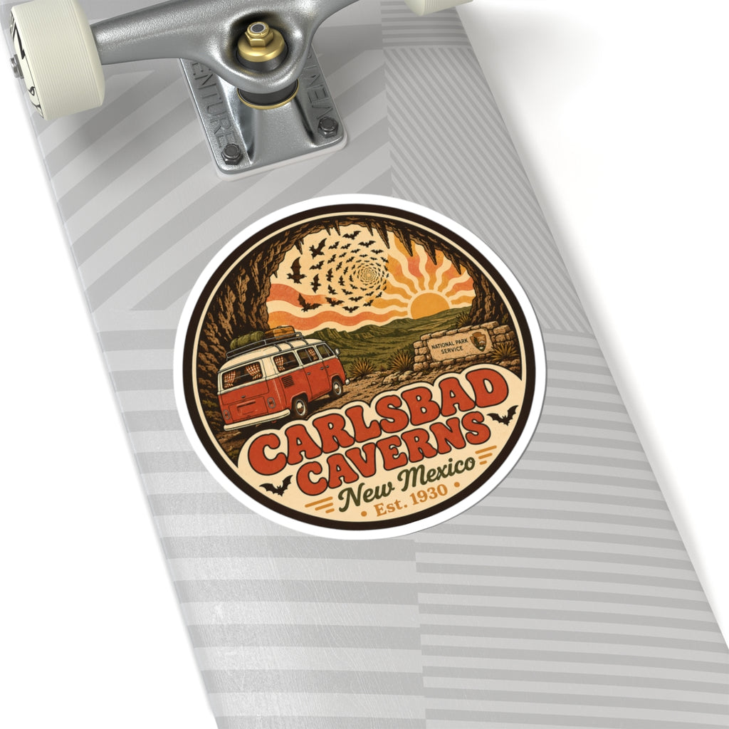 Round Carlsbad Caverns sticker on a gray striped notebook cover, featuring orange camper van art