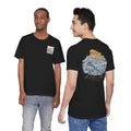 Black crewneck T-shirt with small chest stamp graphic and large back temple illustration