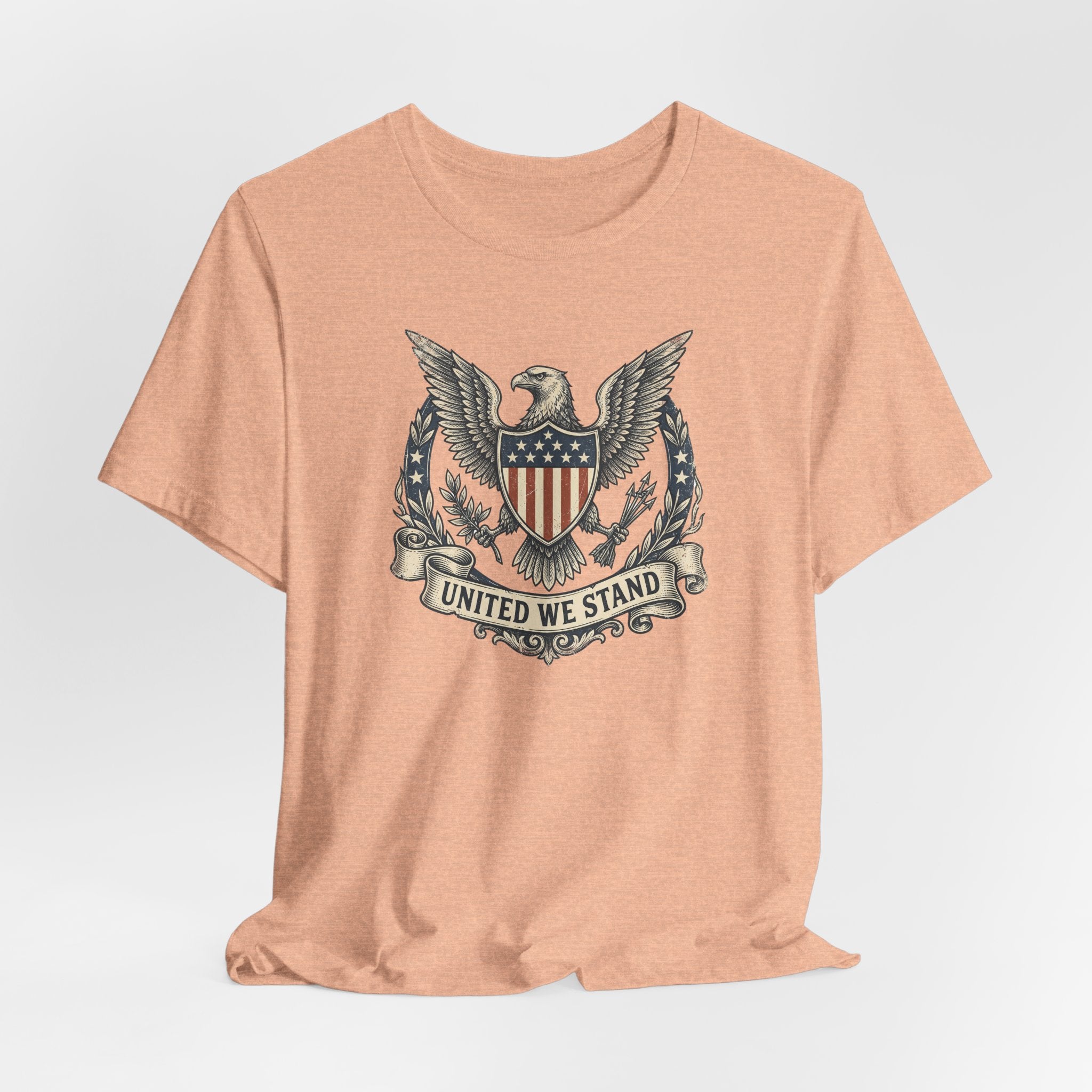 Coral crewneck T-shirt with United We Stand shield-and-eagle graphic on front