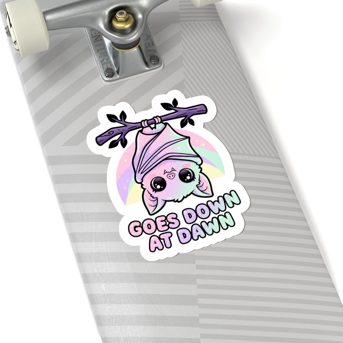 Kawaii kiss-cut vinyl sticker featuring purple bat, pink hood, and "GOES DOWN AT DAWN" text