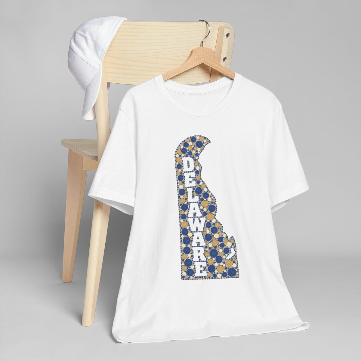 White T-shirt with blue-and-gold Delaware map alphabet graphic on the front