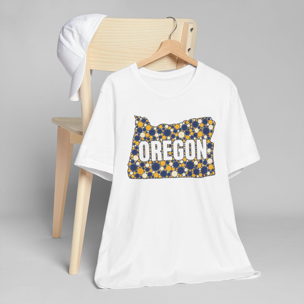 White t-shirt with Oregon polka dot map graphic in blue and gold on front