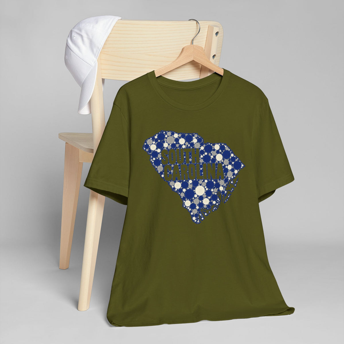 Olive green t-shirt with blue dotted South Carolina map graphic.
