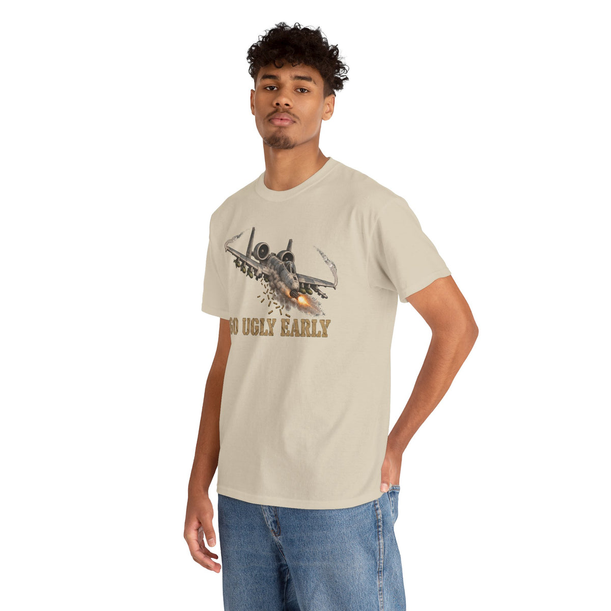 Beige short-sleeve crewneck T-shirt with jet graphic and "GO UGLY EARLY" text.