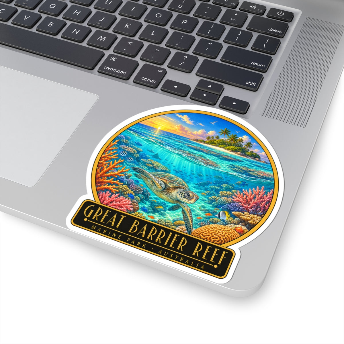 Great Barrier Reef vinyl decal on laptop keyboard showing sea turtle over coral reef
