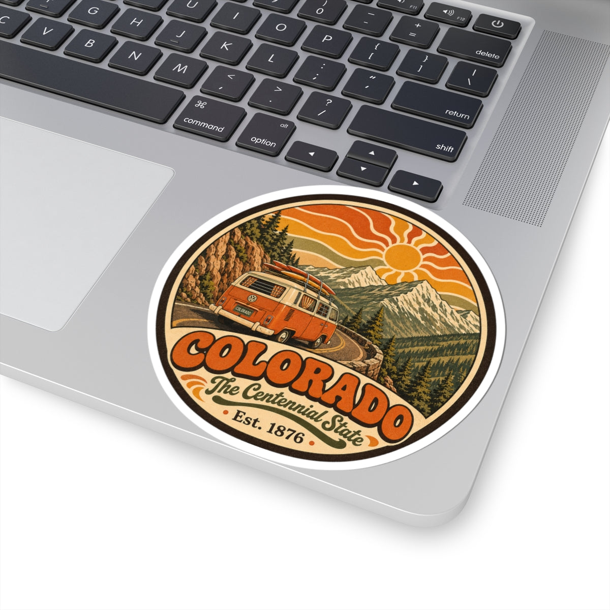 Round Colorado camper van sticker on a laptop, showing full circular design