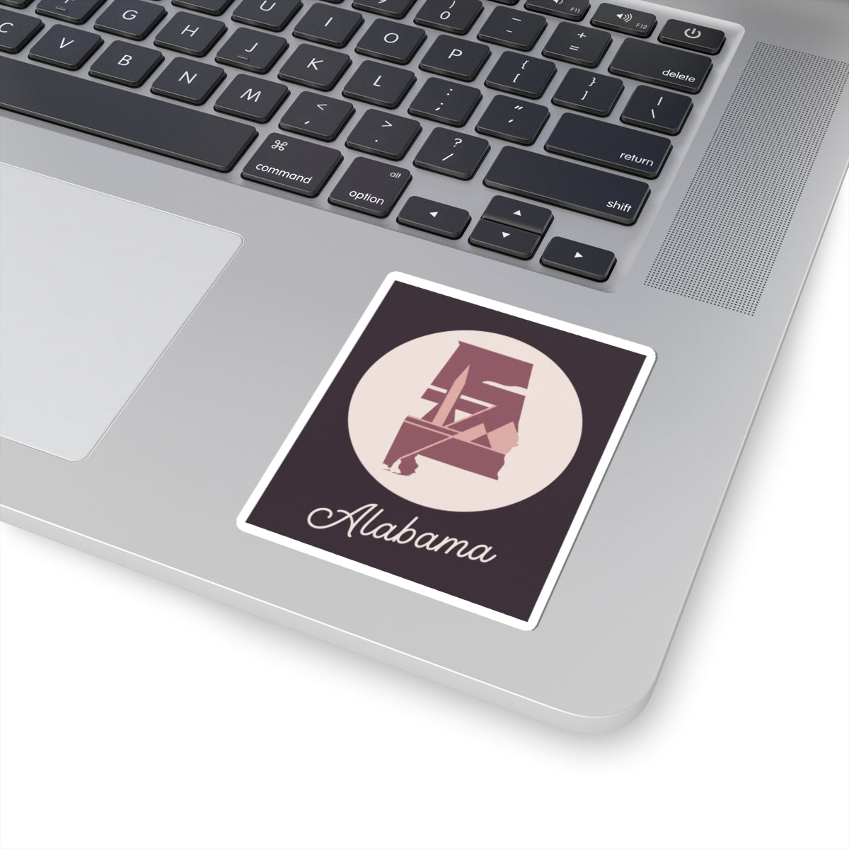 Alabama silhouette vinyl decal with mauve logo, cream circle, and 'Alabama' script, white outline