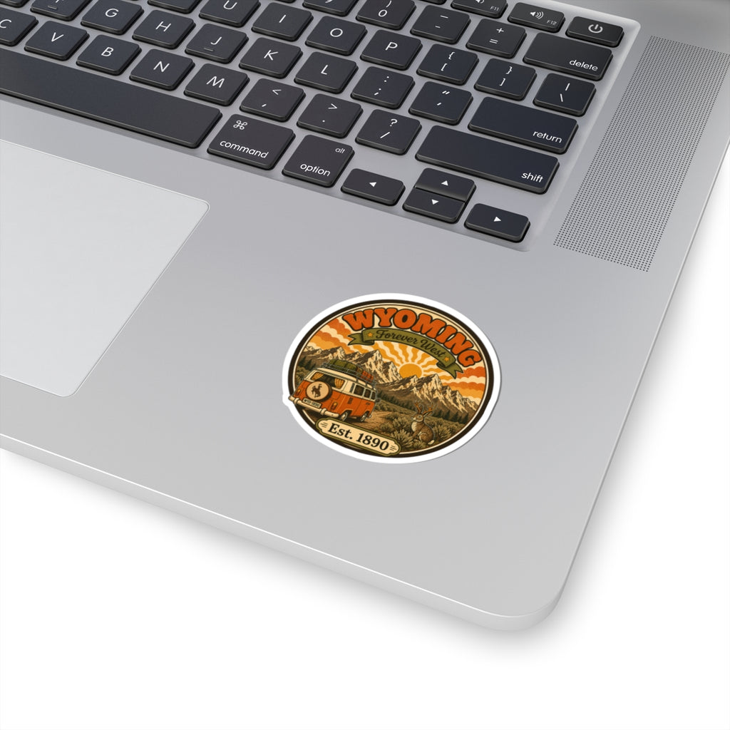 Round kiss-cut vinyl sticker with vintage Wyoming mountains, orange bus, rabbit, “Est. 1890”