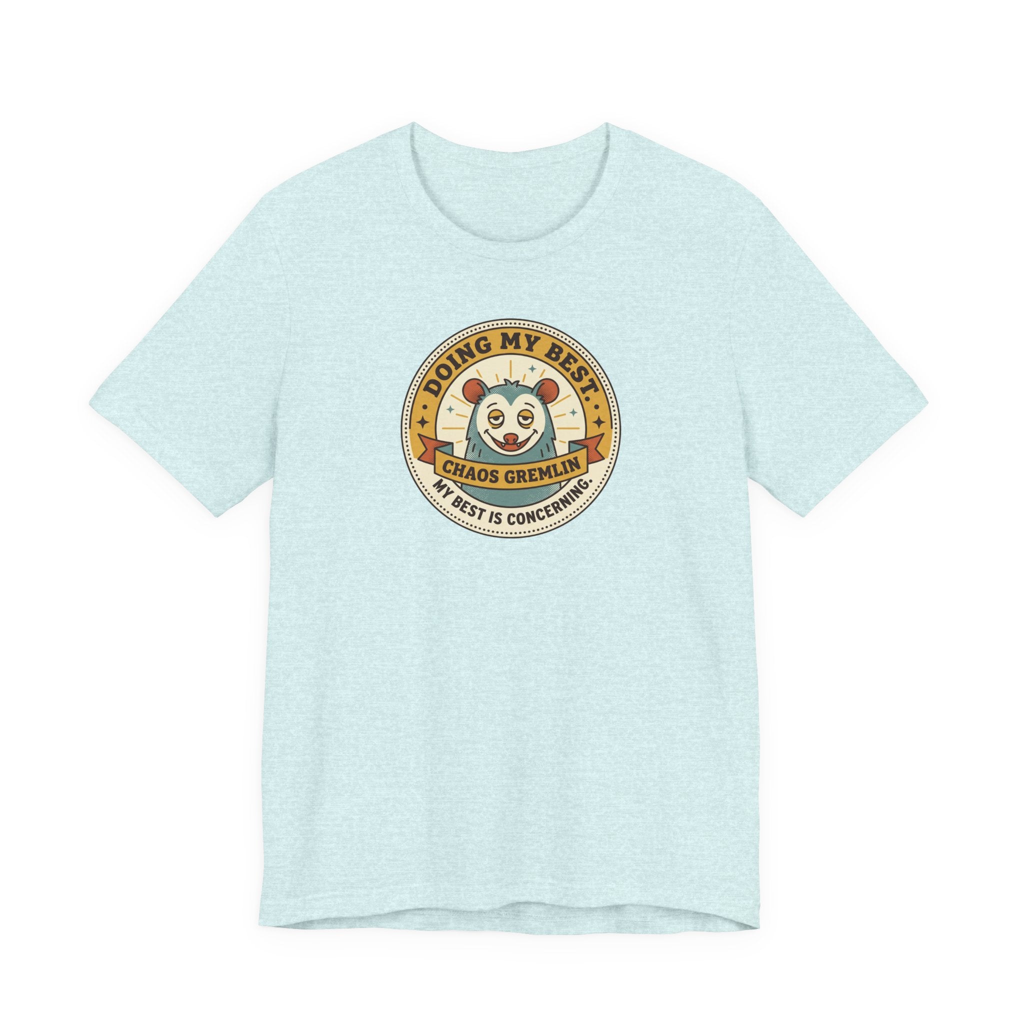 Light aqua T-shirt with round gremlin badge graphic on center chest