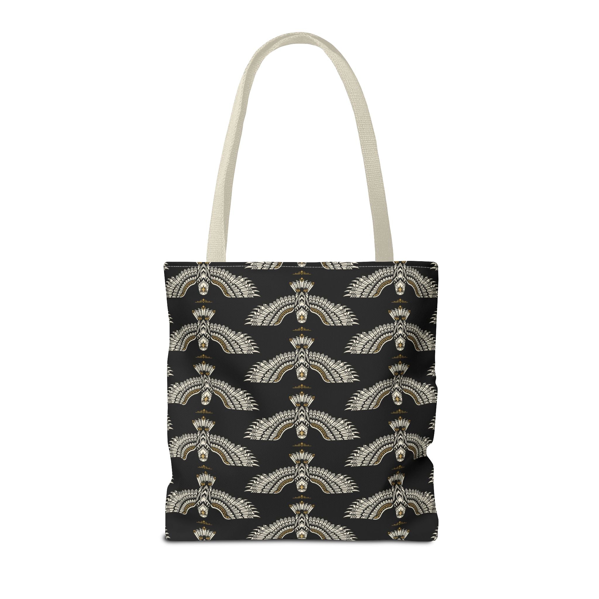 Scarab motif tote bag on white background, black fabric with gold repeating winged designs
