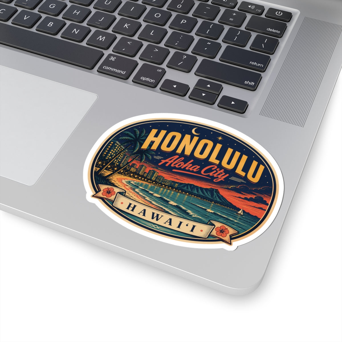 Honolulu luggage tag sticker on laptop, oval 'Honolulu' and 'Hawai‘i' beach illustration