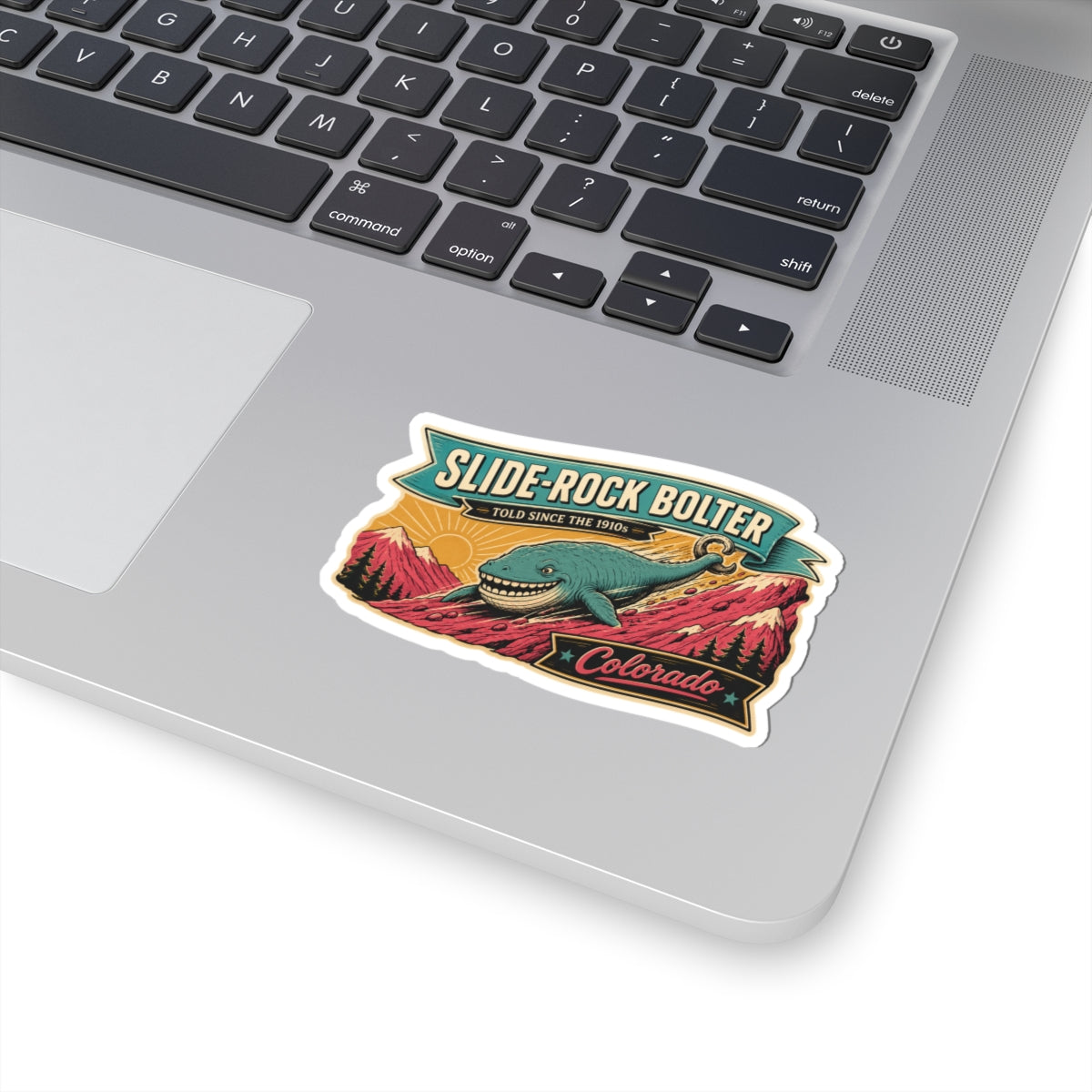 Outdoor sticker with teal whale illustration, red peaks, and Slide-Rock Bolter