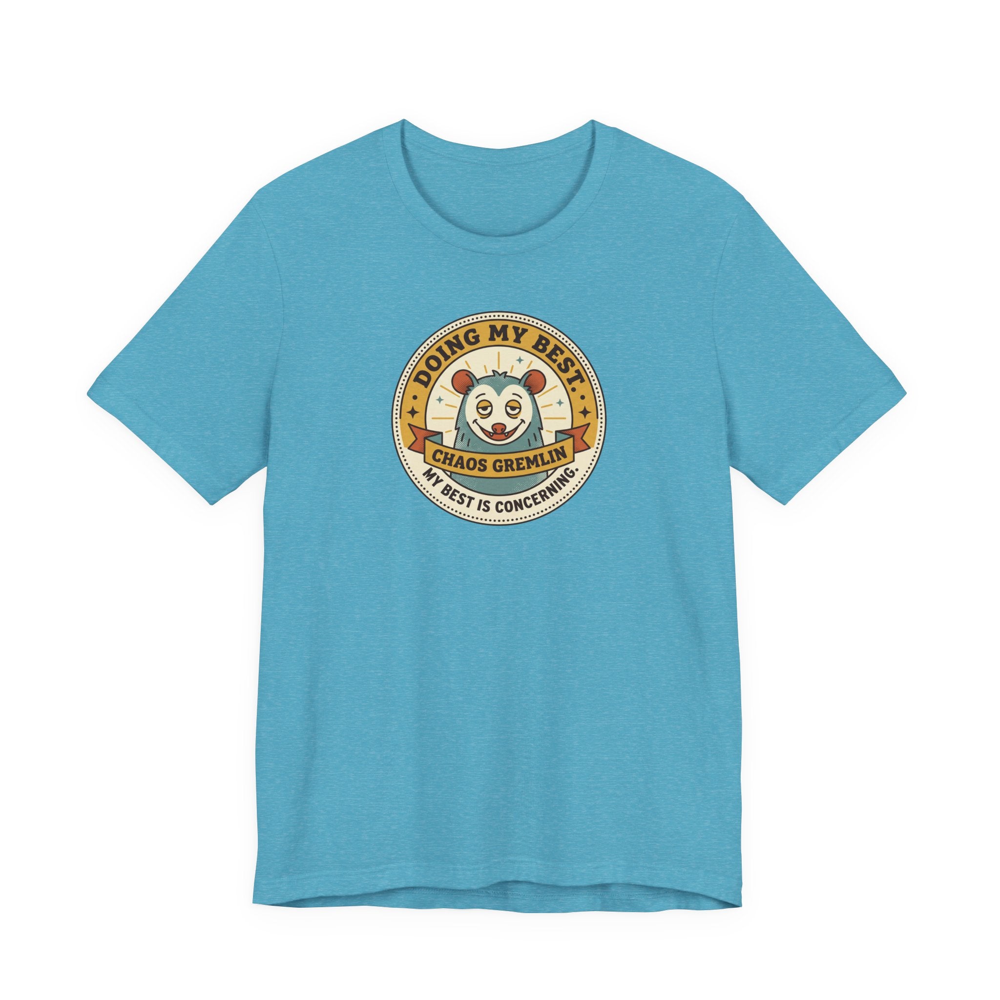 Turquoise T-shirt with round gremlin badge graphic on center chest