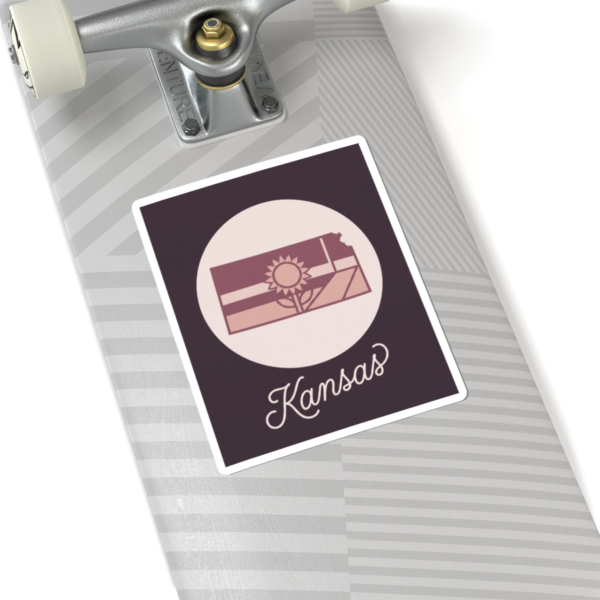 Kansas state silhouette mauve vinyl sticker decal with sunburst design and “Kansas” lettering