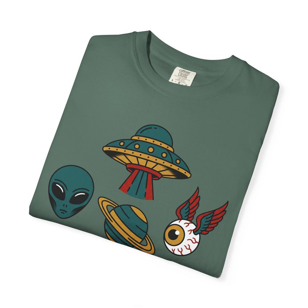 Green crewneck T-shirt with alien UFO patchwork graphic on front.