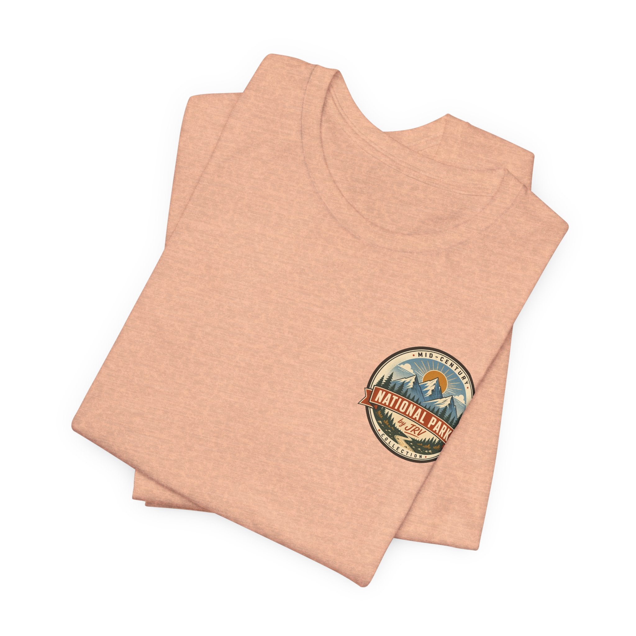 Crater Lake souvenir t-shirt, heather peach, folded crewneck with small circular logo