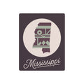 Plum and sage metal wall art with Mississippi silhouette and southwest pattern inside a circle