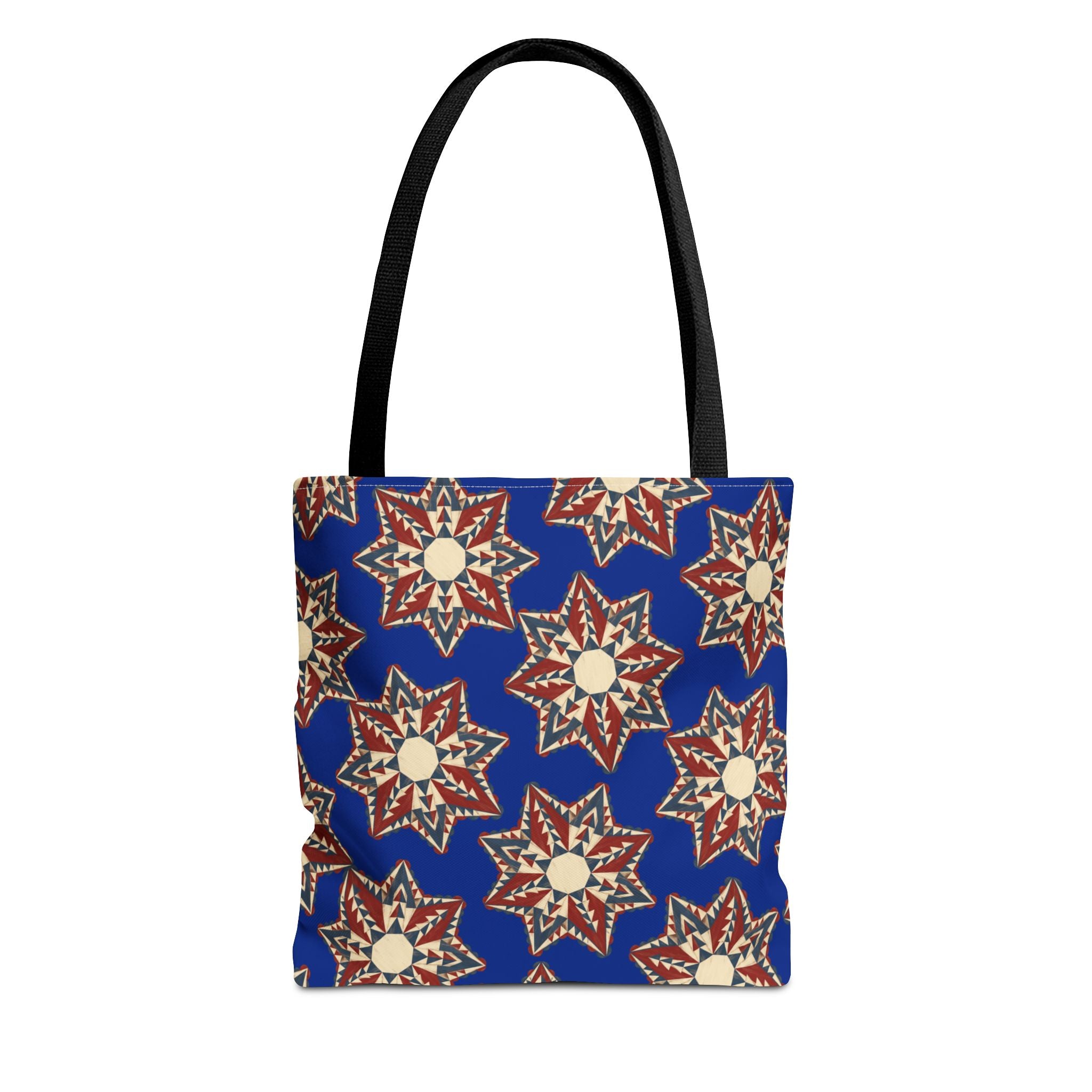 Blue tote bag with starburst floral pattern and black handles