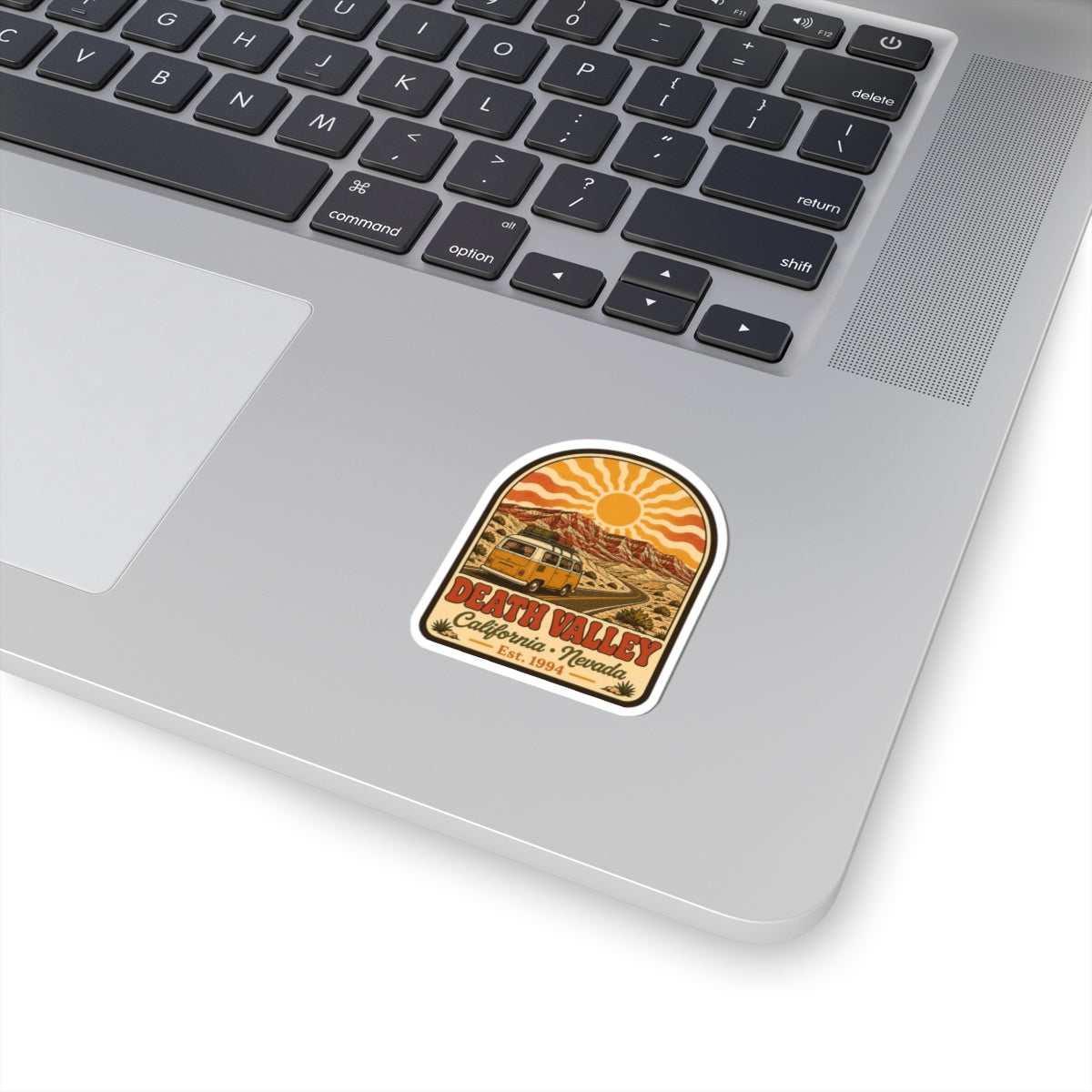Arched vintage desert landscape sticker with camper van, bright sun, and decorative border