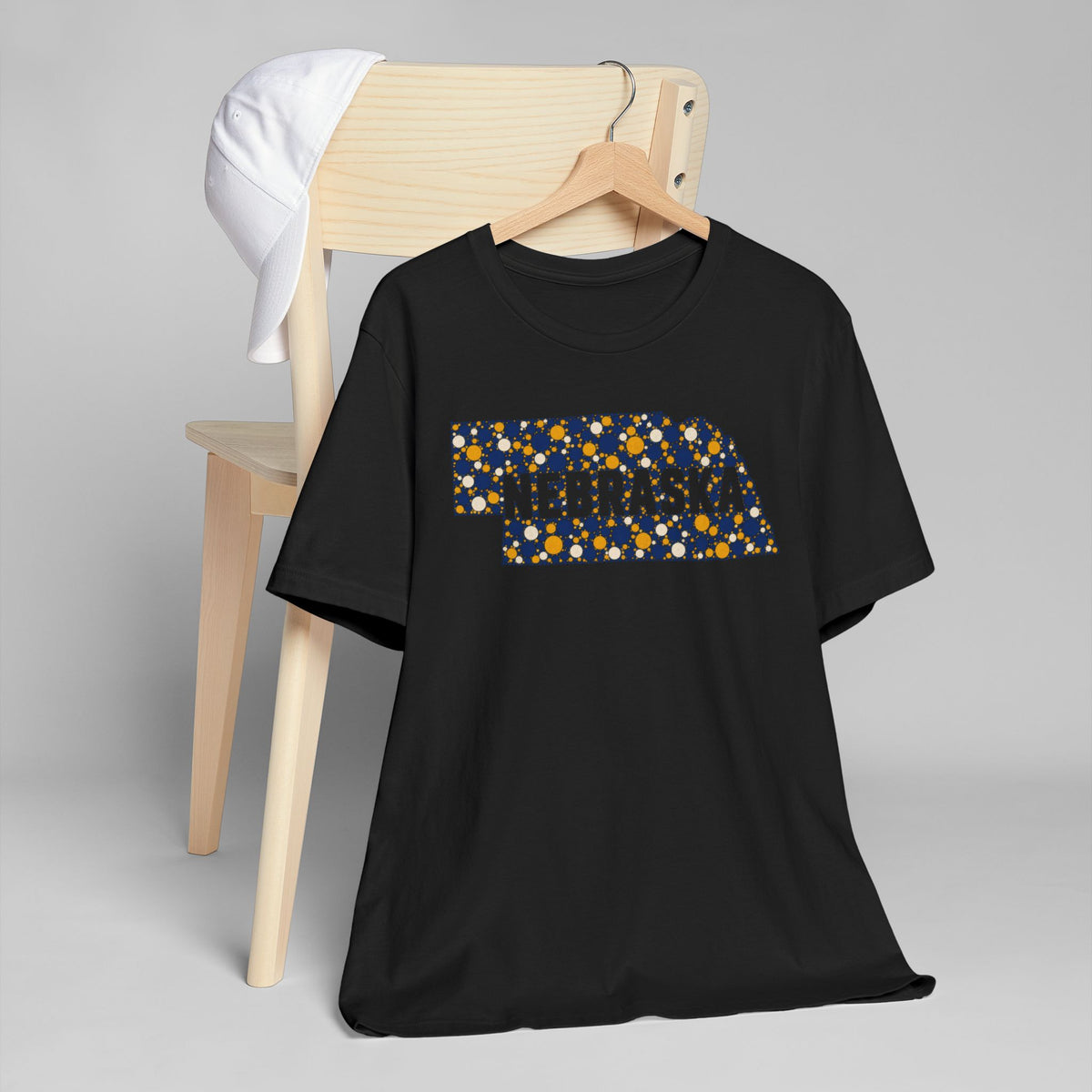 Black crewneck t-shirt with colorful Nebraska map floral graphic